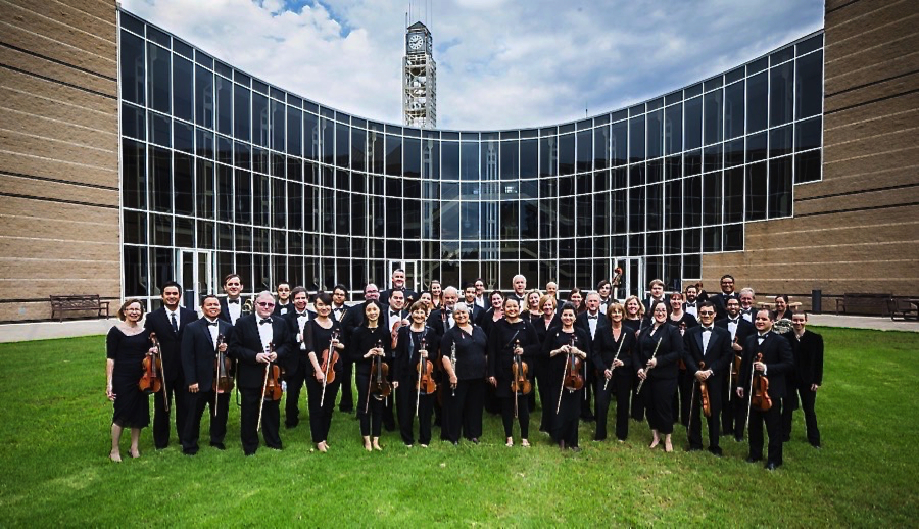 Symphony Irvine members standing in front of the Irvine Civic Center.